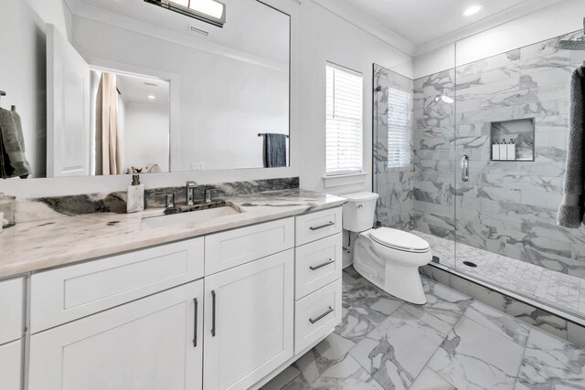 bathroom with toilet, vanity, ornamental molding, tile patterned floors, and walk in shower