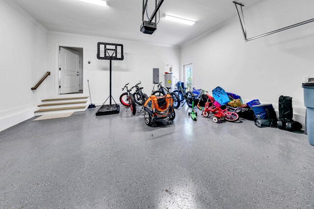 garage with a garage door opener and electric panel