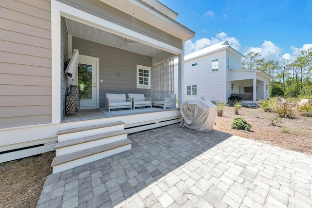 view of patio / terrace with outdoor lounge area and a baseboard heating unit