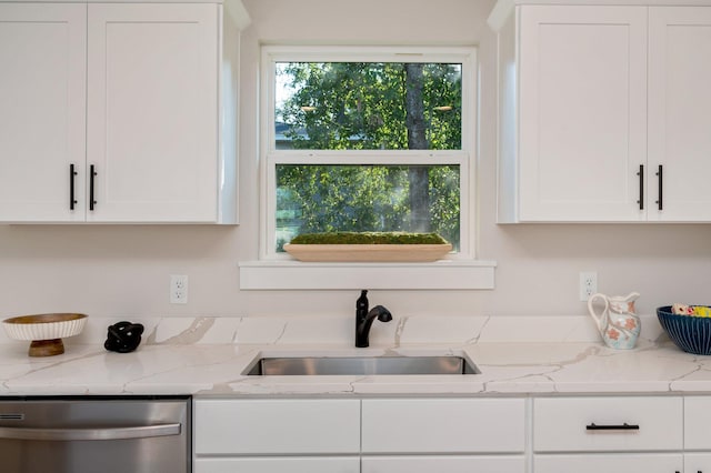 kitchen with sink, white cabinets, dishwasher, and light stone counters