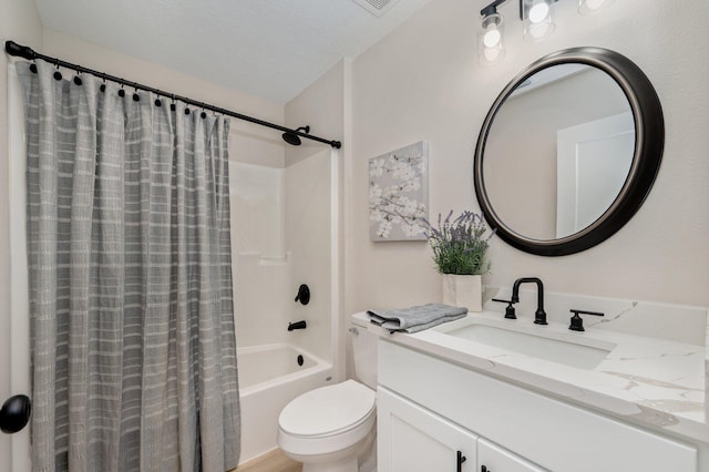 full bathroom with toilet, vanity, a textured ceiling, and shower / bath combo with shower curtain