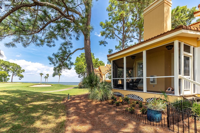 view of yard with a sunroom