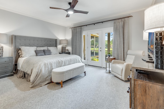 carpeted bedroom with french doors, ornamental molding, access to outside, and ceiling fan