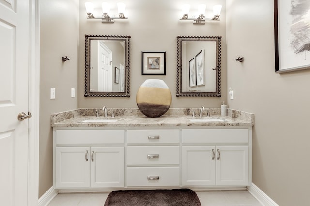 bathroom featuring tile patterned flooring and vanity