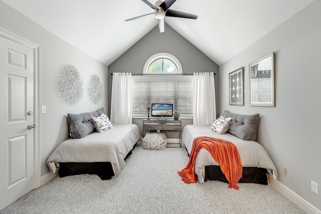 carpeted bedroom featuring lofted ceiling and ceiling fan