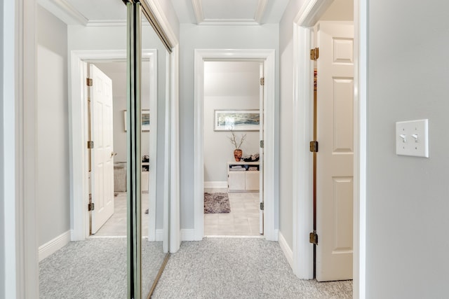 hallway featuring light colored carpet