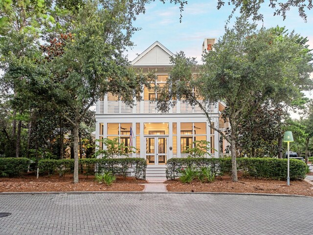 view of front facade with a balcony and covered porch