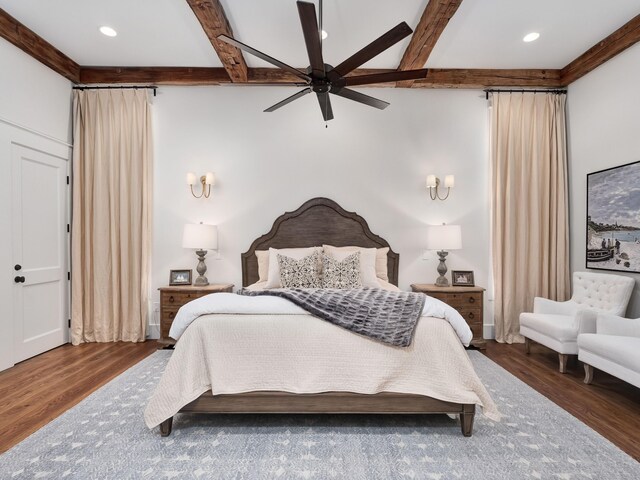 bedroom featuring ceiling fan, beamed ceiling, and dark hardwood / wood-style floors