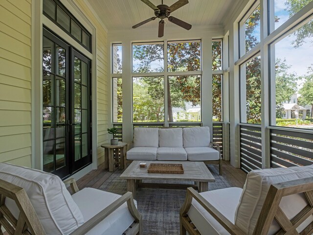 sunroom / solarium with ceiling fan