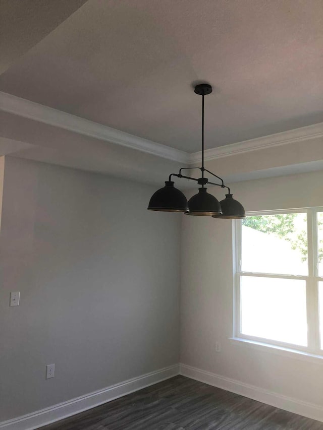 unfurnished dining area with a notable chandelier and dark hardwood / wood-style flooring