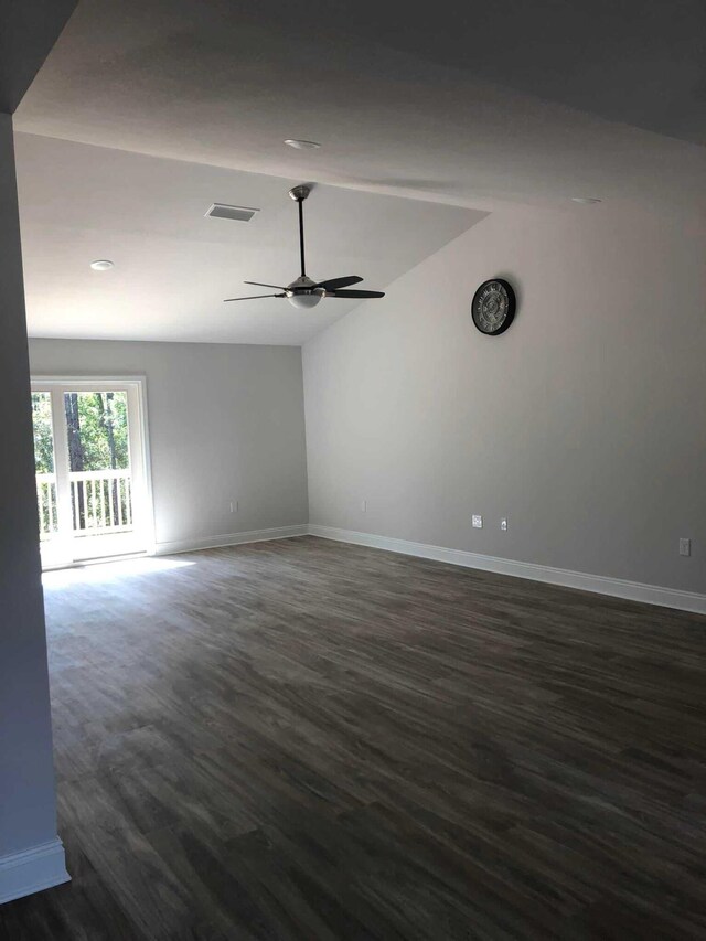 unfurnished room with ceiling fan, hardwood / wood-style floors, and lofted ceiling