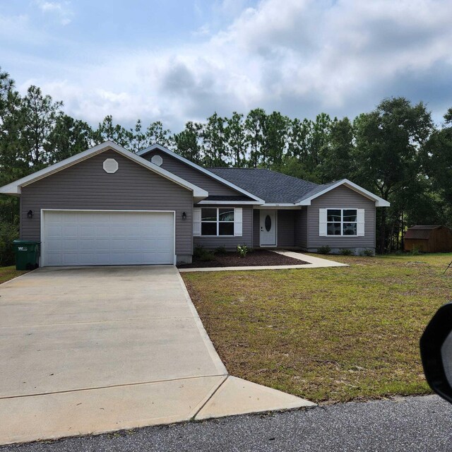 ranch-style home with a garage and a front yard