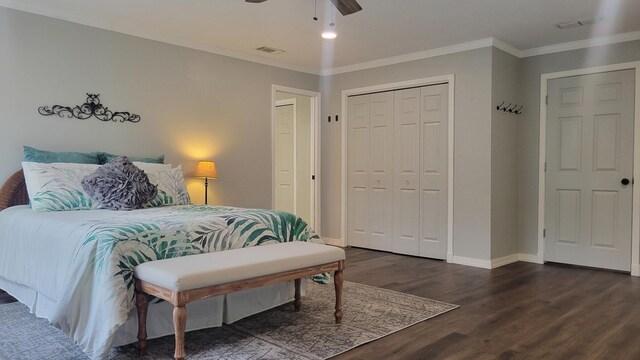 bedroom with ceiling fan, ornamental molding, and dark hardwood / wood-style flooring