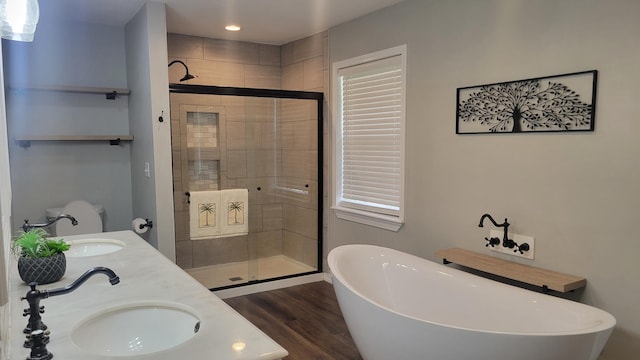 bathroom with vanity, separate shower and tub, and wood-type flooring