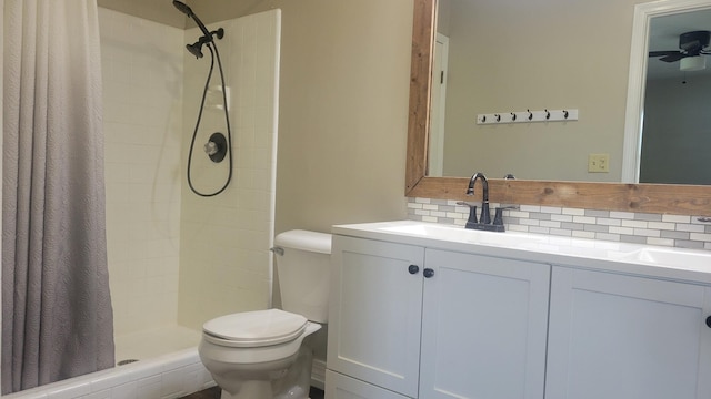 bathroom with curtained shower, toilet, decorative backsplash, and vanity