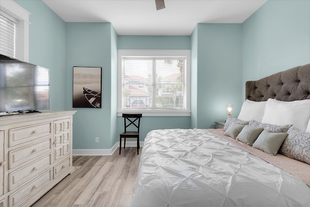 bedroom featuring ceiling fan and light wood-type flooring