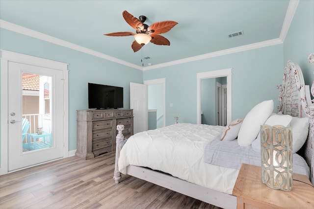 bedroom featuring ceiling fan, hardwood / wood-style floors, and ornamental molding