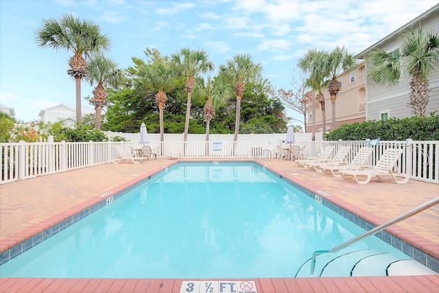 view of swimming pool with a patio area