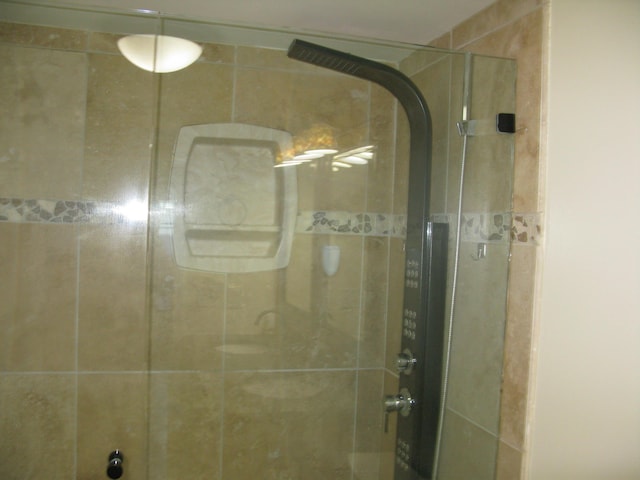 bathroom featuring a shower stall