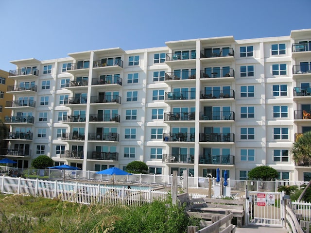 view of property with fence