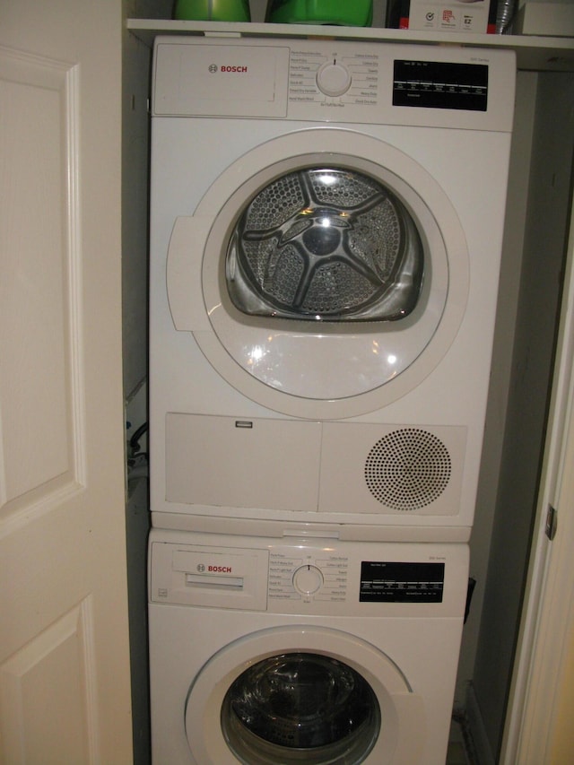 laundry room featuring stacked washing maching and dryer