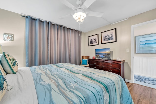 bedroom with light hardwood / wood-style flooring and ceiling fan