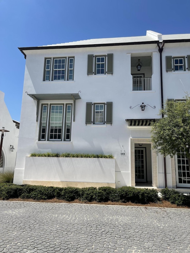 view of front of house featuring stucco siding