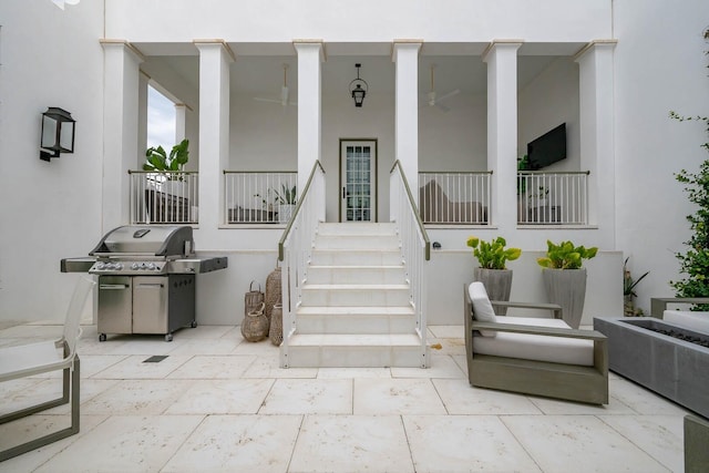 property entrance featuring a patio area and stucco siding