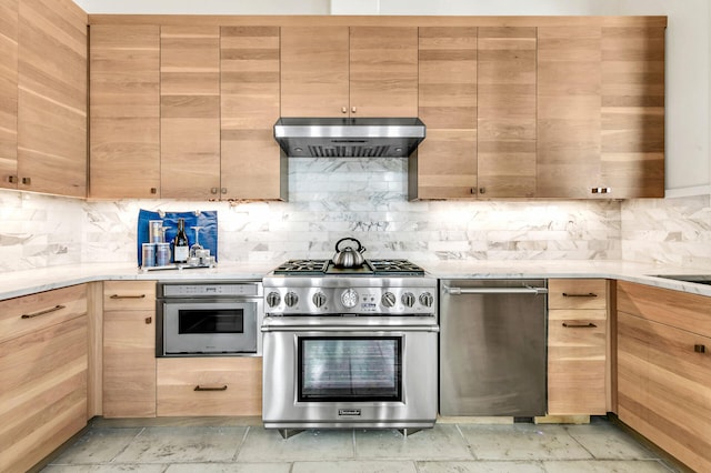 kitchen featuring under cabinet range hood, tasteful backsplash, stainless steel appliances, and light brown cabinetry