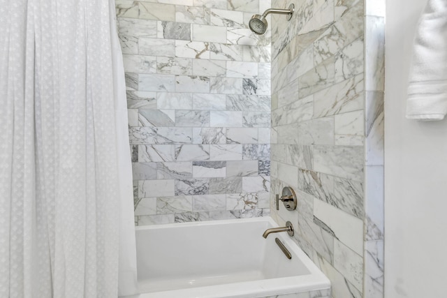 bathroom with shower / tub combo with curtain