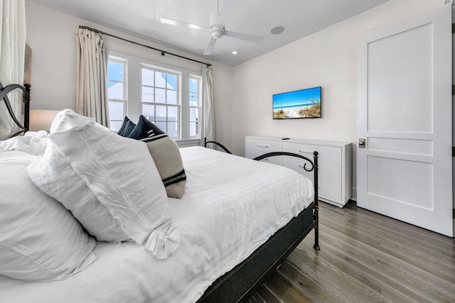 bedroom with ceiling fan and wood finished floors