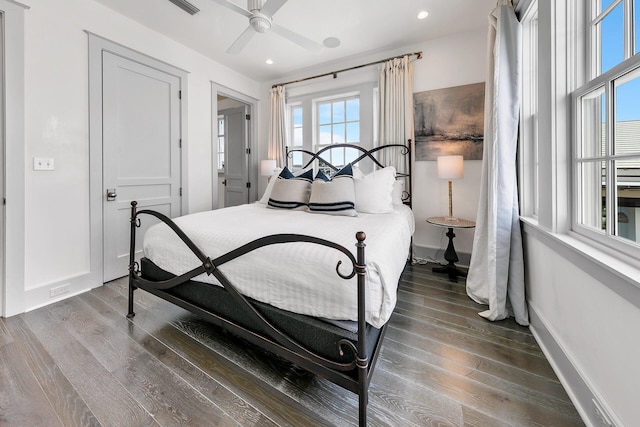 bedroom with a ceiling fan, recessed lighting, baseboards, and wood finished floors