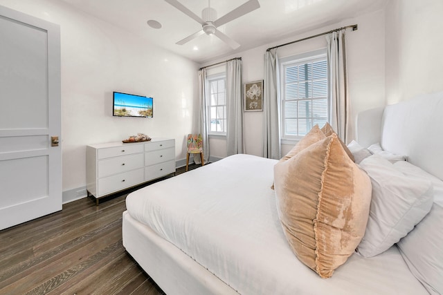 bedroom featuring a ceiling fan, recessed lighting, dark wood-style flooring, and baseboards