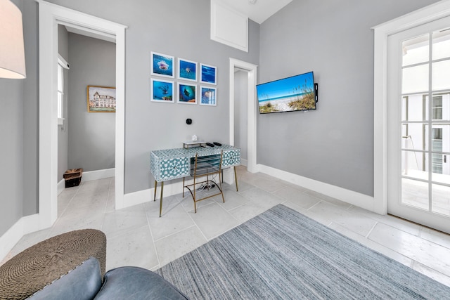 office featuring baseboards and tile patterned floors