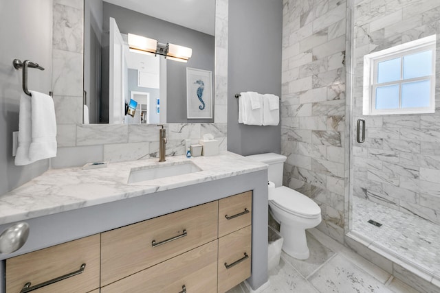 full bathroom featuring marble finish floor, tasteful backsplash, toilet, a shower stall, and vanity