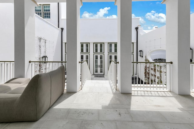 exterior space featuring french doors and stucco siding