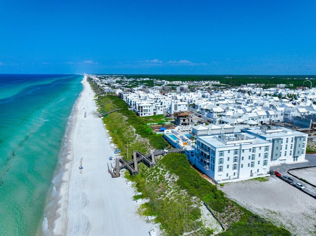 bird's eye view featuring a view of the beach and a water view