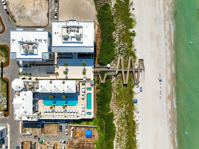 bird's eye view featuring a water view and a view of the beach