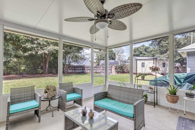 sunroom / solarium with ceiling fan