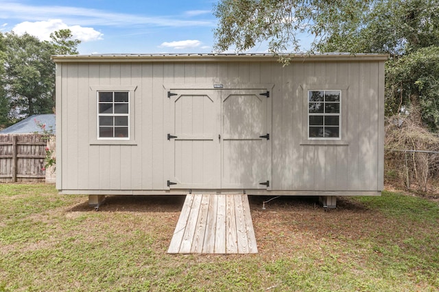 view of outdoor structure with a lawn