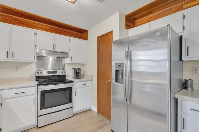 kitchen with white cabinets, a textured ceiling, appliances with stainless steel finishes, and light hardwood / wood-style flooring