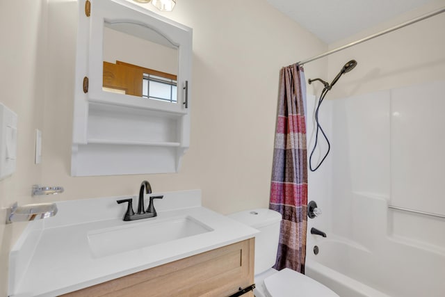 full bathroom with vanity, shower / bath combo, and toilet