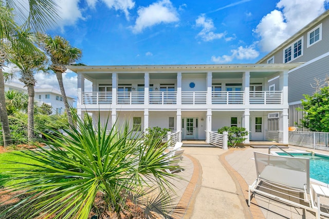 rear view of property with a balcony