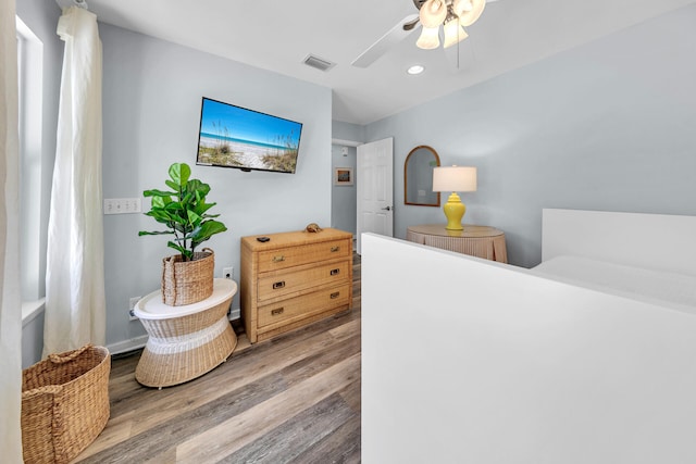 bedroom featuring light hardwood / wood-style flooring and ceiling fan