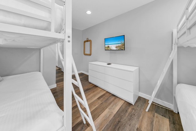 bedroom featuring dark hardwood / wood-style flooring