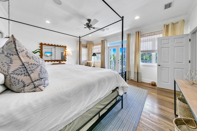 bedroom with access to outside, wood-type flooring, and ceiling fan