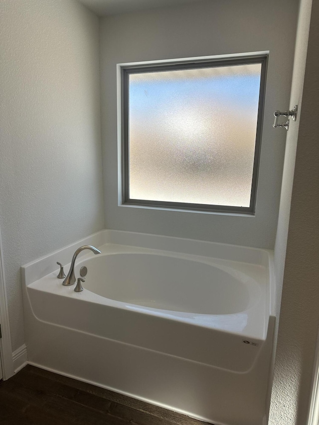 bathroom featuring a washtub