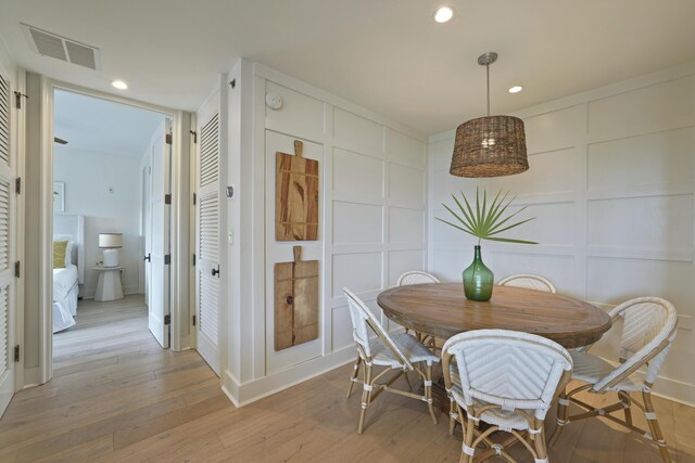 dining space featuring light hardwood / wood-style flooring