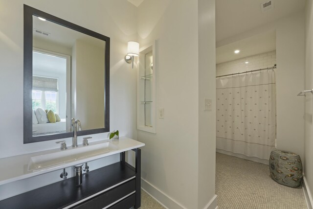 bathroom featuring tile patterned floors, a shower with curtain, and vanity