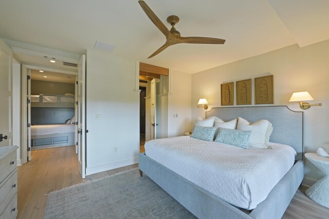 bedroom with ceiling fan and light wood-type flooring